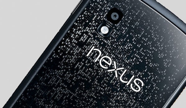 Google Nexus 4 smartphone with water droplets on back cover.