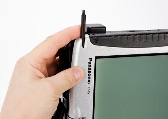 Hand holding a Panasonic Toughbook CF-19 with stylus.