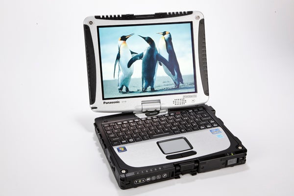 Panasonic Toughbook CF-19 with penguin wallpaper on screen.