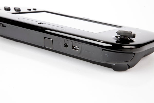 Close-up of a black Wii U GamePad on a white background.
