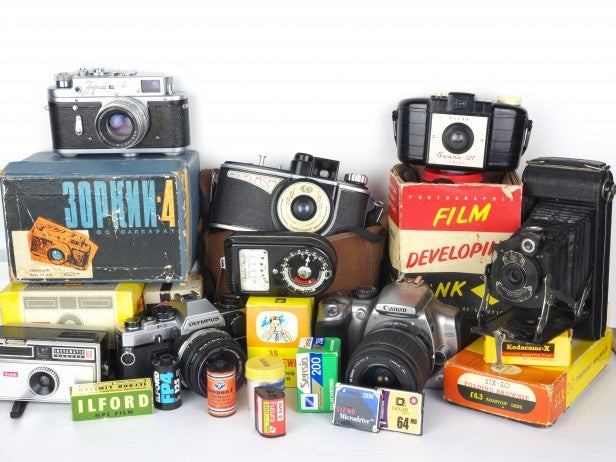 Collection of vintage cameras and photography equipment.