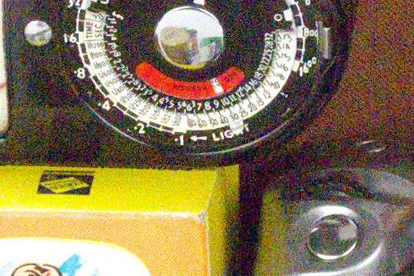 Close-up of Panasonic Lumix GH3 camera dials and settings.