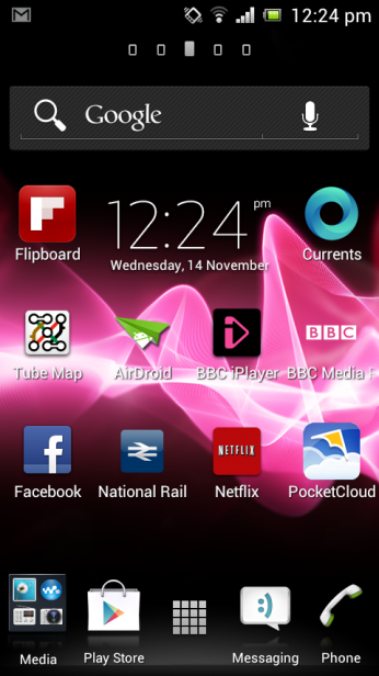 Sony Xperia J smartphone displaying various apps on screen.Sony Xperia J smartphone displaying social media feed.