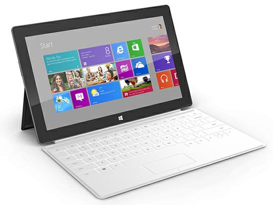 Microsoft Surface tablet with keyboard on white background.