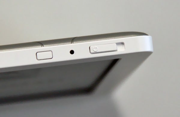 Close-up of Kobo Glo e-reader's top edge with buttons.
