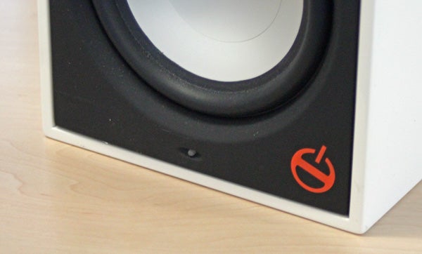 Close-up of Paradigm Shift A2 speaker's power button and woofer.