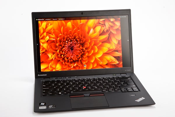 Lenovo ThinkPad X1 Carbon laptop with vibrant display.