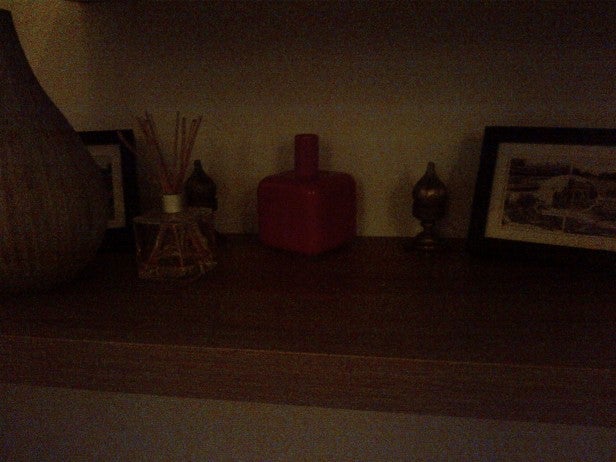 Dark photo of household items on a shelf