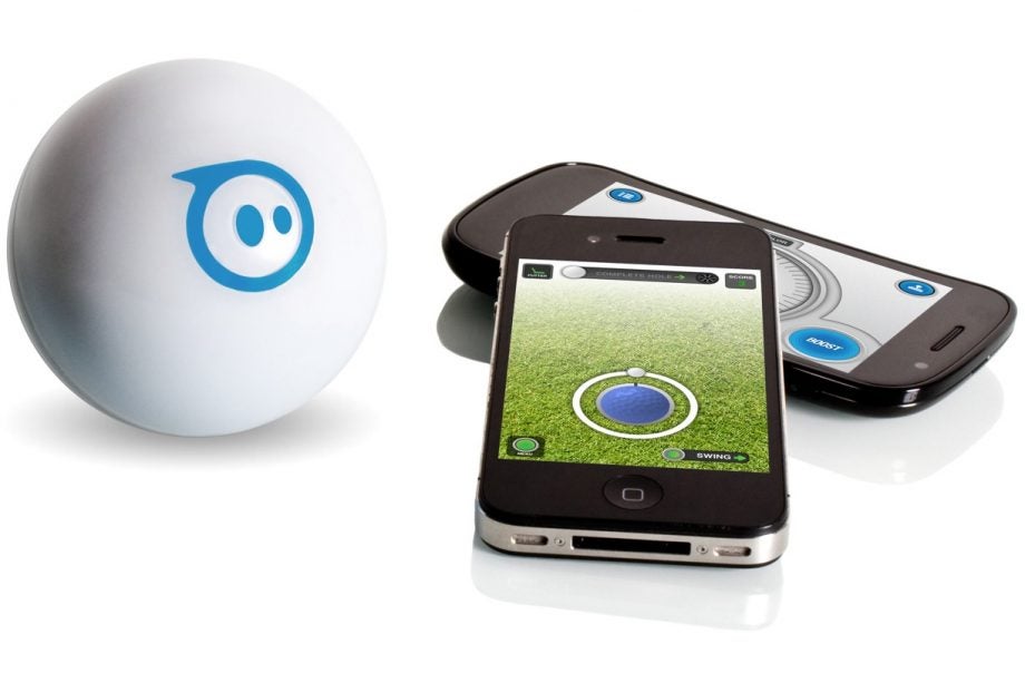 Orbotix Sphero robot with smartphones displaying control app.