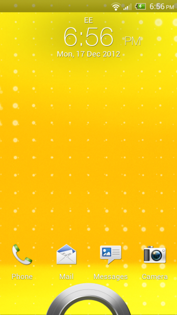 HTC One XL home screen with yellow wallpaper and apps.