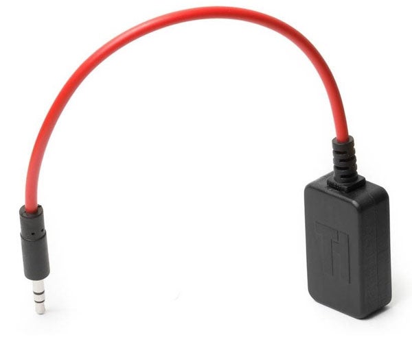 Triggertrap Mobile dongle with red connection cable.