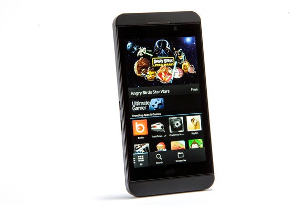Black smartphone displaying colorful app icons on screen.