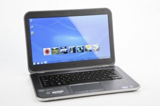 Dell Inspiron 14z Ultrabook with open screen displaying desktop.