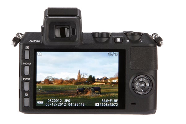 Nikon 1 V2 camera displaying menu settings on LCD screen.Nikon 1 V2 camera displaying a photo on its screen.