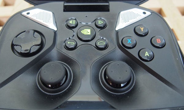 Nvidia Project Shield running a first-person shooter game.Close-up of Nvidia Project Shield's controls and buttons.
