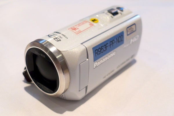 Panasonic HC-V520 camcorder on a white surface.