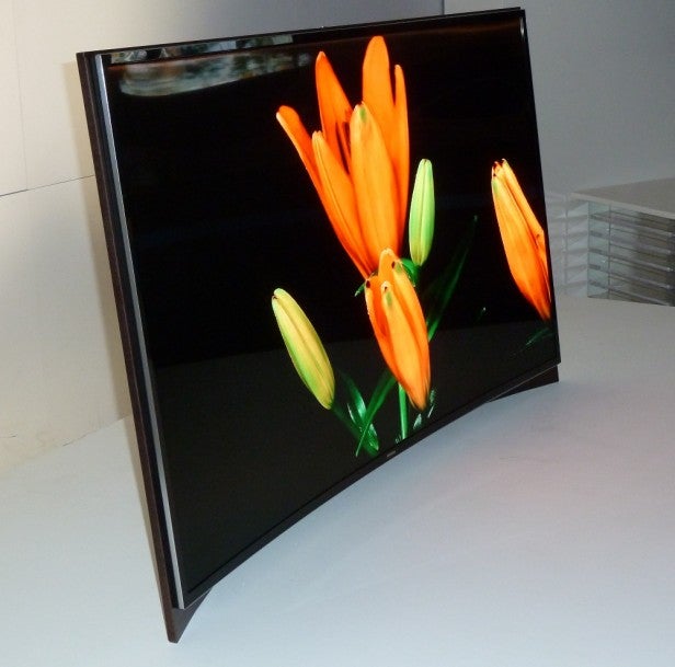 Samsung 55-inch Curved OLED TV displaying vibrant flowers.Samsung 55-inch Curved OLED TV displaying vibrant flower image.