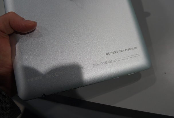 Hand holding an Archos 97 Platinum tablet.