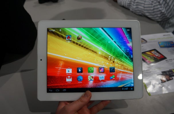 Archos 97 Platinum tablet held in hand displaying screen.