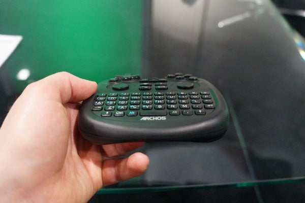 Hand holding the Archos TV Connect remote control.