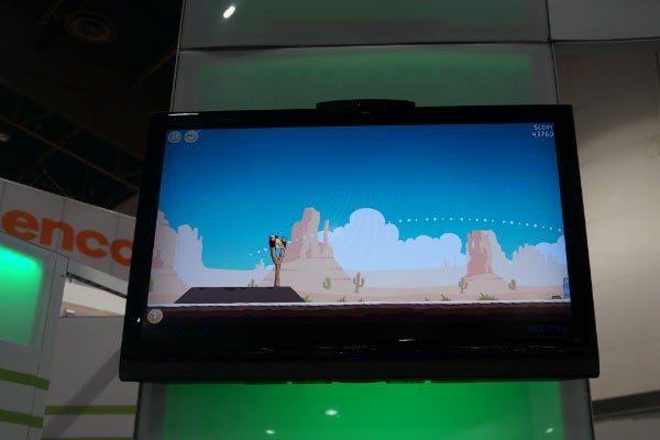 Archos TV Connect displaying a platform game on screen.