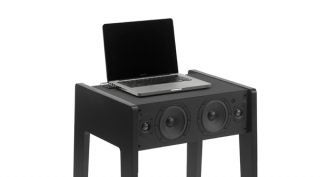 La Boite Concept LD 100 desk with built-in speakers and laptop.