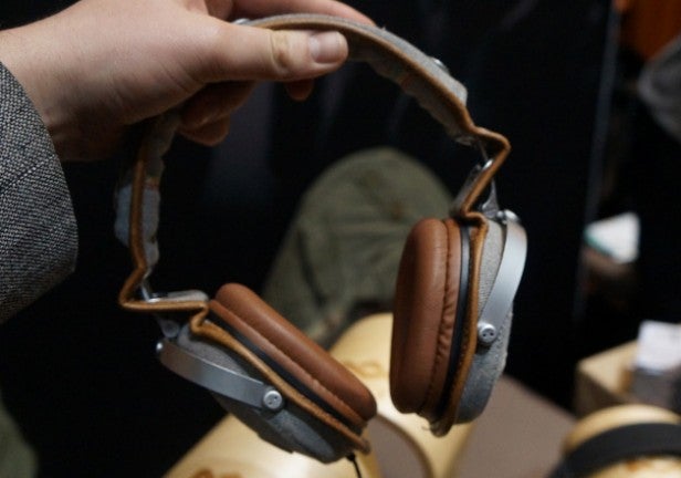 Person holding House of Marley Rise Up headphones.Hand holding House of Marley Rise Up headphones