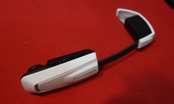 Vuzix Smart Glasses M100 on a red background.