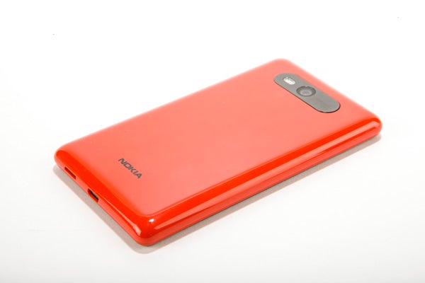 Nokia Lumia 820 smartphone in red on white background.