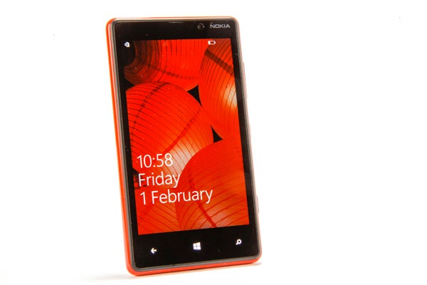Nokia Lumia 820 smartphone displaying date and time on screen.