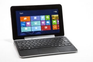 Dell XPS 10 tablet with keyboard dock and Windows interface.