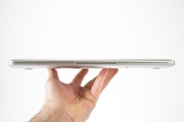 Hand holding Samsung Series 3 Chromebook showing thin profile