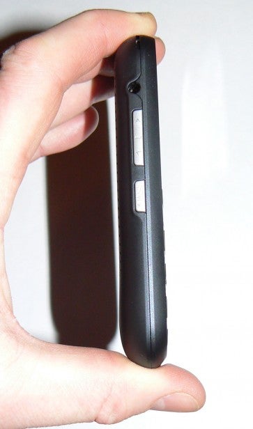 Hand holding a smartphone highlighting side buttons
