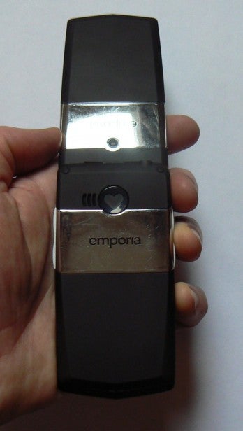 Hand holding Emporia CLICK flip phone open.