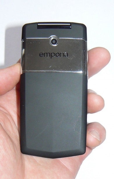 Hand holding a simple Emporia mobile phone