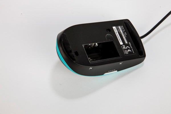 IRIScan Mouse with built-in scanner on white surface.