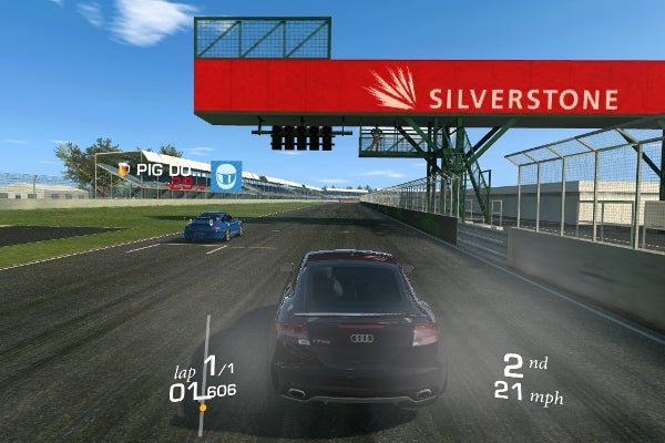 Screenshot of Real Racing 3 gameplay showing cars racing at Silverstone track.