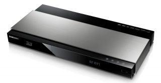 Samsung BD-F7500 3D Blu-ray player with display clock.