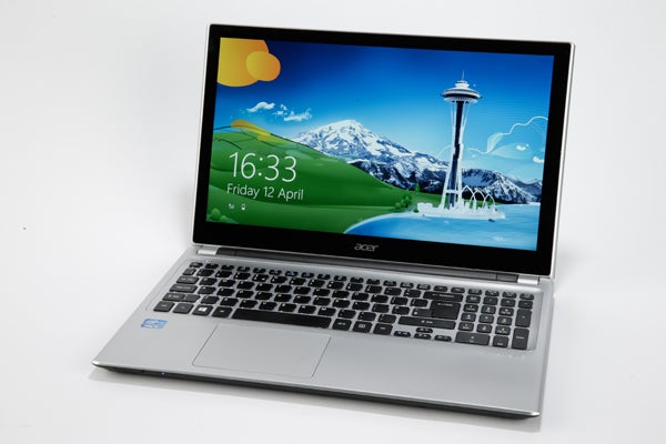 Acer Aspire V5-571 Touch laptop with screen on displaying wallpaper.