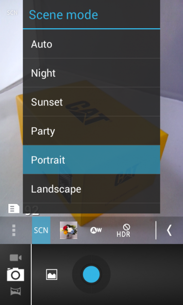Smartphone camera interface with scene mode selection menu.