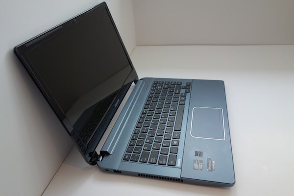 Toshiba Satellite U940 laptop on a white surface.