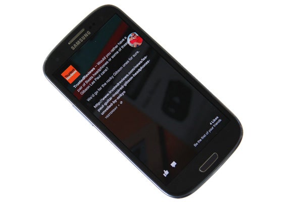 Samsung smartphone displaying Facebook Home interface.