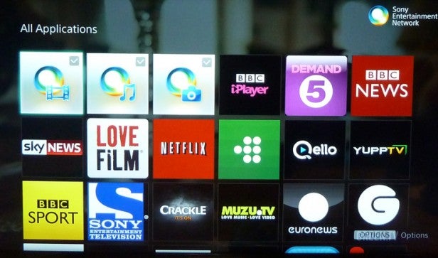 Smart TV screen displaying various streaming application icons.