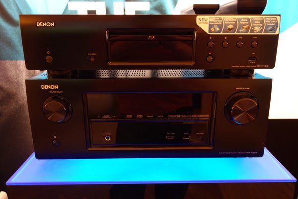 Denon AVR-X2000 receiver on display with illuminated stand