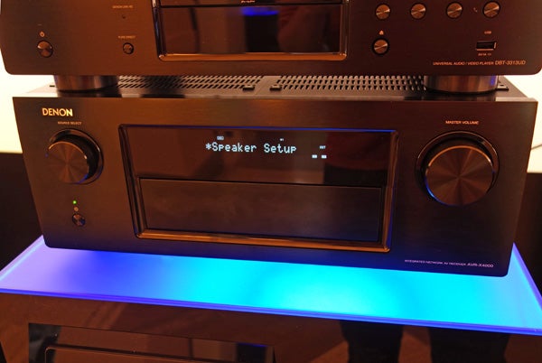Denon AVR-X4000 receiver displaying speaker setup menu.Denon AVR-X4000 home theater receiver front view.