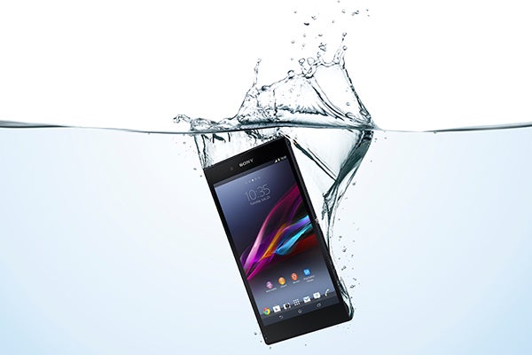 Sony Xperia Z Ultra smartphone partially submerged in water.