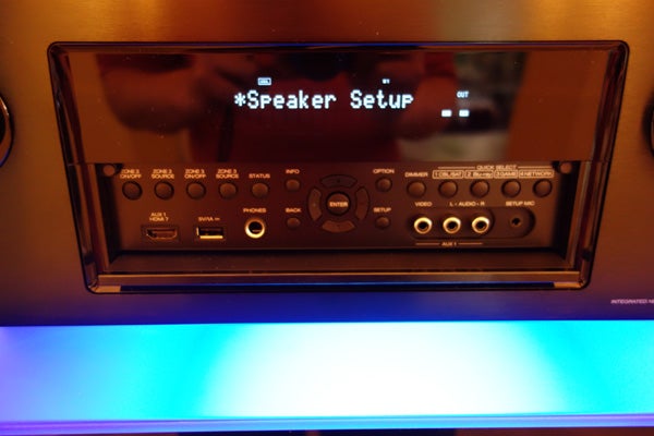 Denon AVR-X4000 receiver front panel with display illuminated.