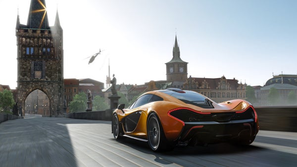 Forza Motorsport 5 screenshot with a racing car in a city.