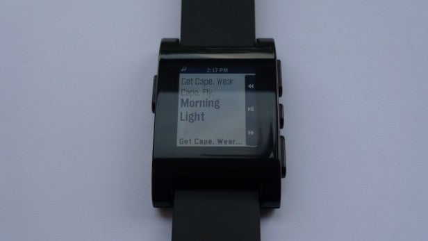 Smartwatch displaying text message notification on screen.