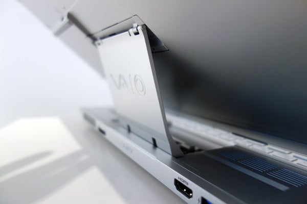 Sony Vaio Duo 13 laptop in slate mode showing ports and hinge.Sony Vaio Duo 13 hybrid laptop with sliding screen design.Sony Vaio Duo 13 hybrid laptop with hinge design.